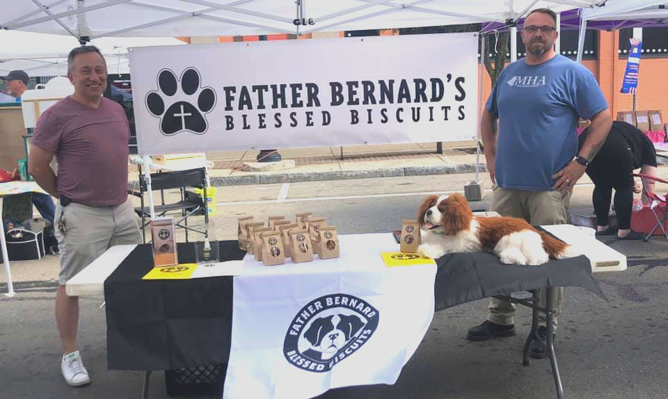 The Mental Health Association’s (MHA) spring newsletter notes Saturday, June 11, as the Jamestown Pride Festival and opening of the Jamestown Public Market downtown. MHA’s Steven Cobb (left) and Sean Jones look forward to being at the Market 10 a.m. to 2 p.m. to sell you Father Bernard’s Blessed Biscuits for your favorite pooch. Father Bernard’s is a social enterprise partnership between the MHA and St. Luke’s Episcopal Church that aims to get people in recovery back into the workforce.
