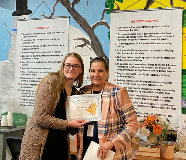 At the April recovery luncheon of the Mental Health Association in Chautauqua County, Finance Director Jill Marsh (right) recognized Jena Vacanti for the basket raffle fundraiser she created that raised over $3,300. 